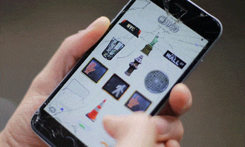 An animated GIF of a hand scrolling through a grid of Real NYC stickers on a cracked iPhone screen.