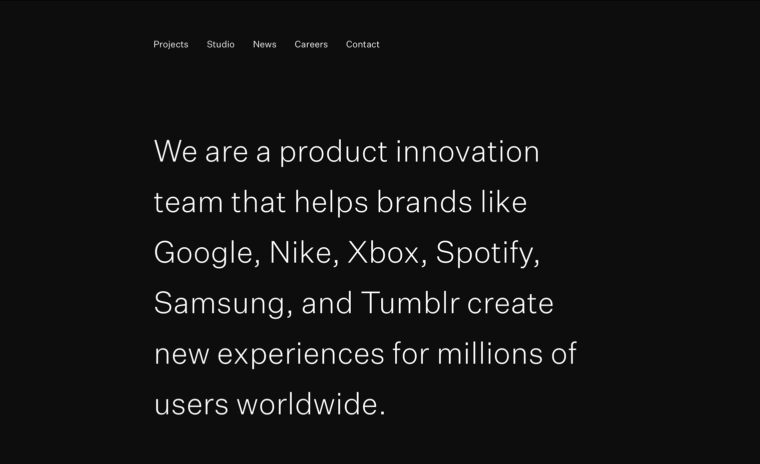 White text on a black background. A text-only site nav sits at the top while the page body is large white text introducing the company.